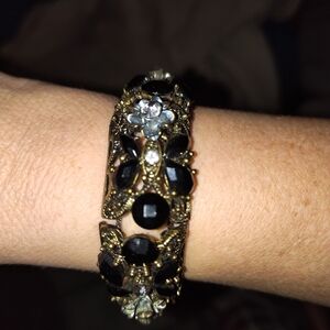 Elegant Black and Gold Floral Bracelet